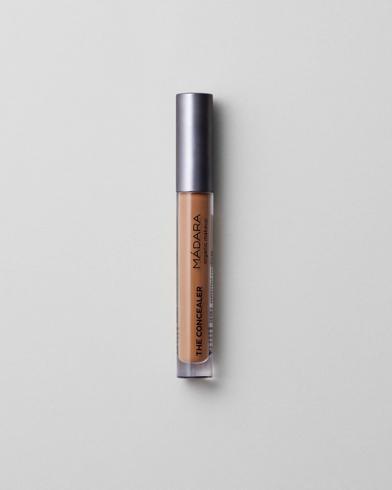 MÁDARA Organic Skincare amber concealer madara cosmetics A6115 concealer product photo on plain background.