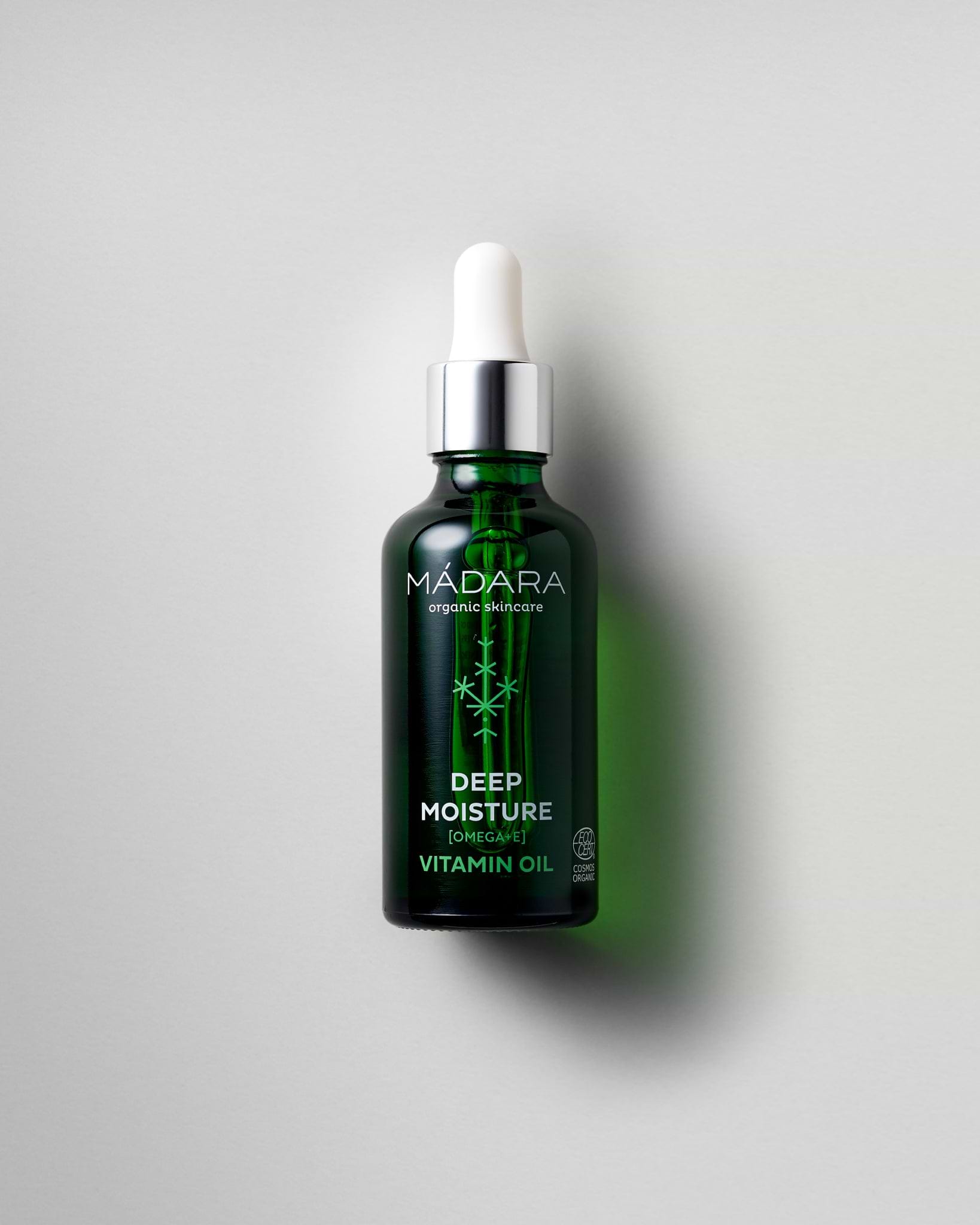 MÁDARA Organic Skincare deep moisture vitamin oil A2281 face oil product photo on plain background.