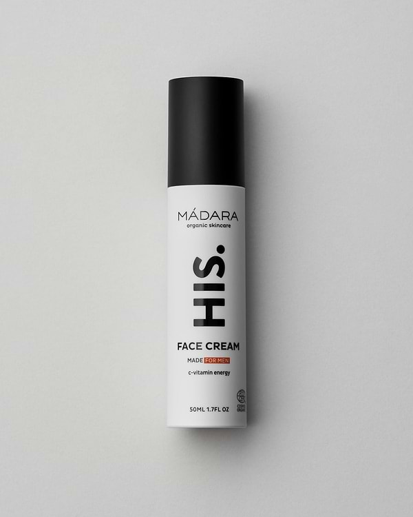 Model wearing MÁDARA Organic Skincare his face cream for men A5003 face cream on skin; close-up portrait shows natural application results.