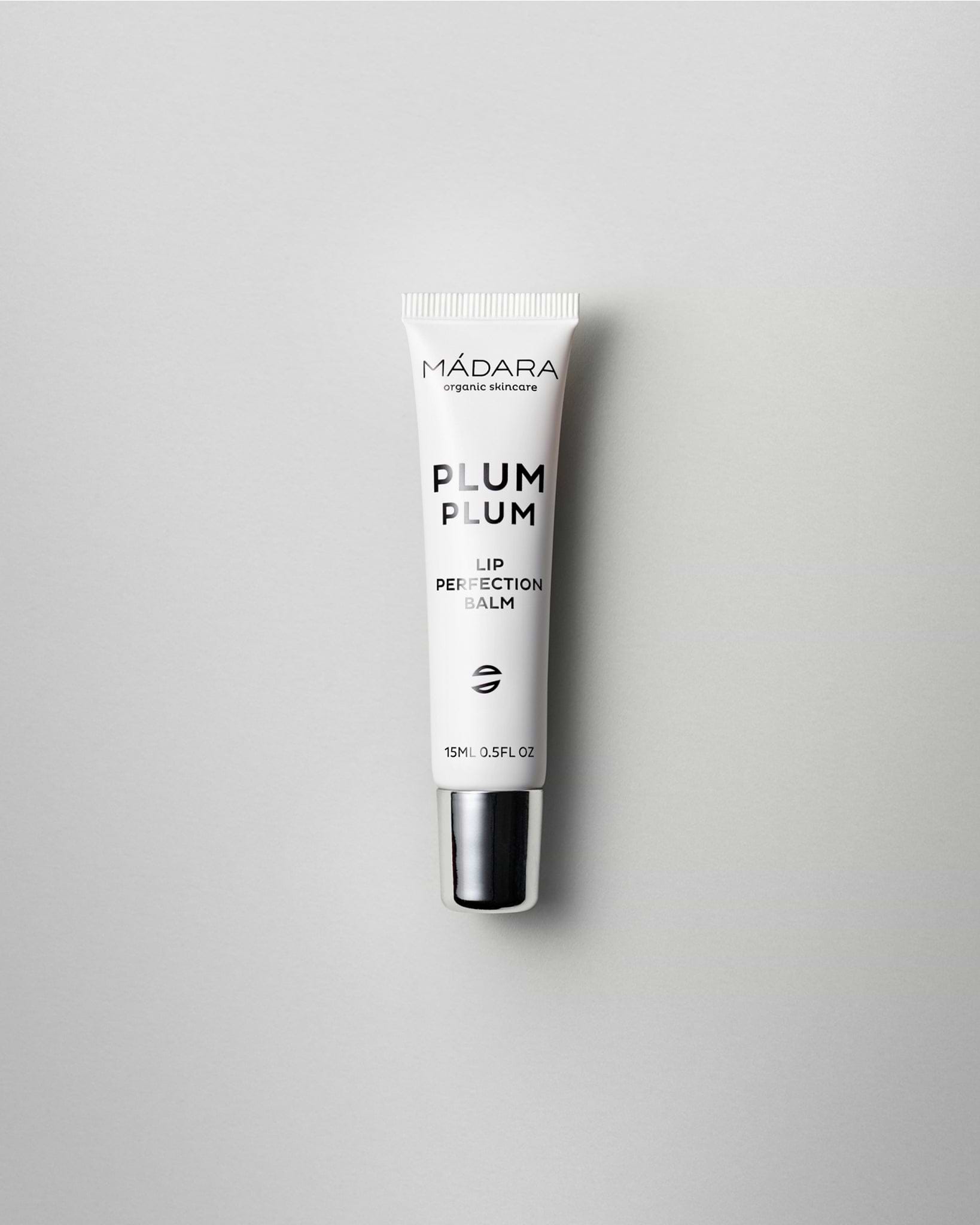 MÁDARA Organic Skincare plum plum lip balm A2291 balm product photo on plain background.