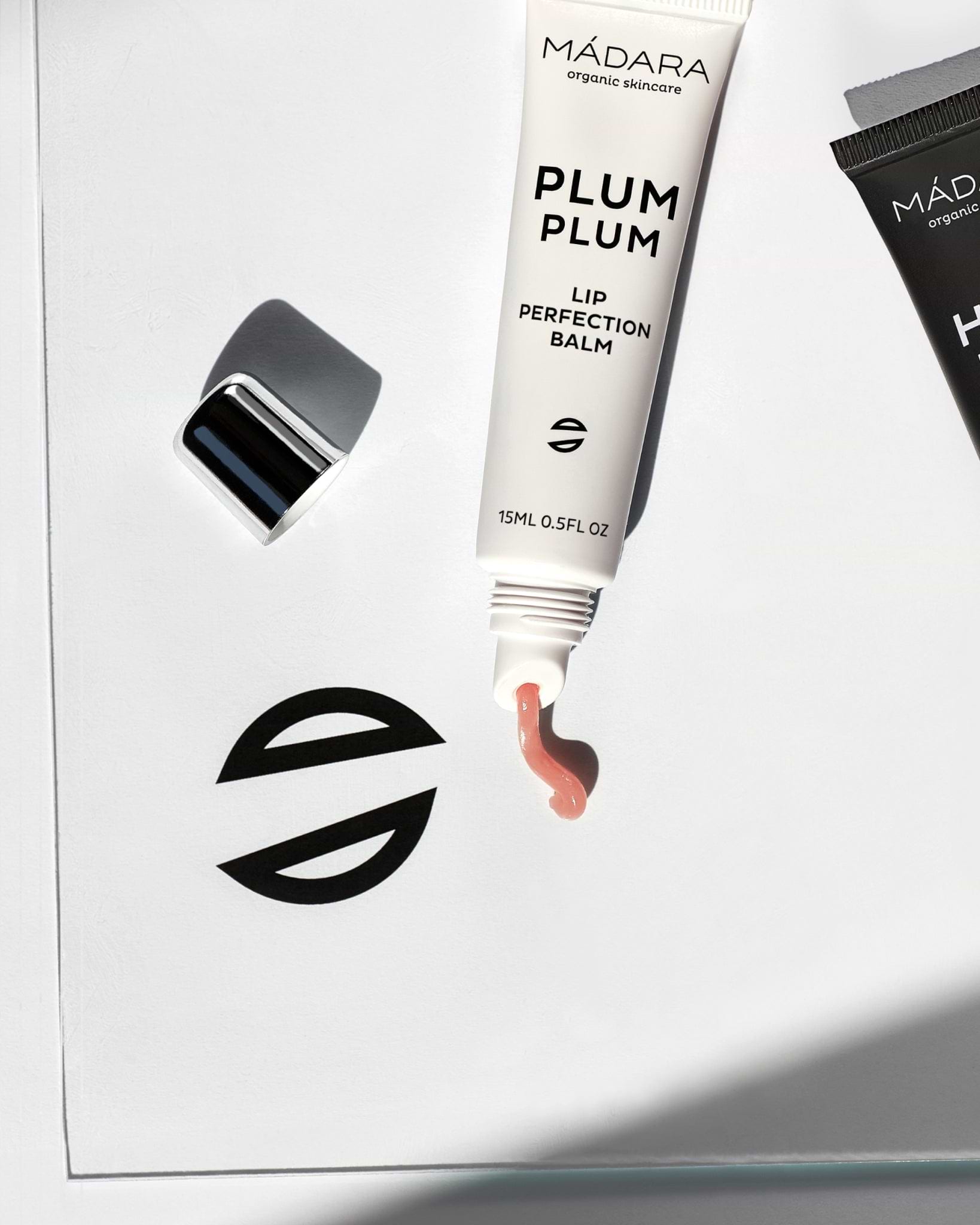 Texture close-up of MÁDARA Organic Skincare lip perfection balm A2291 balm �swatch demonstrates consistency and finish.