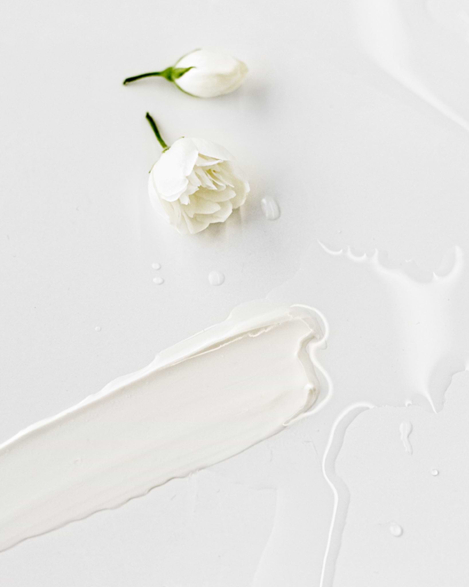 Texture close-up of MÁDARA Organic Skincare makeup cleansing milk A2002 �swatch demonstrates consistency and finish.