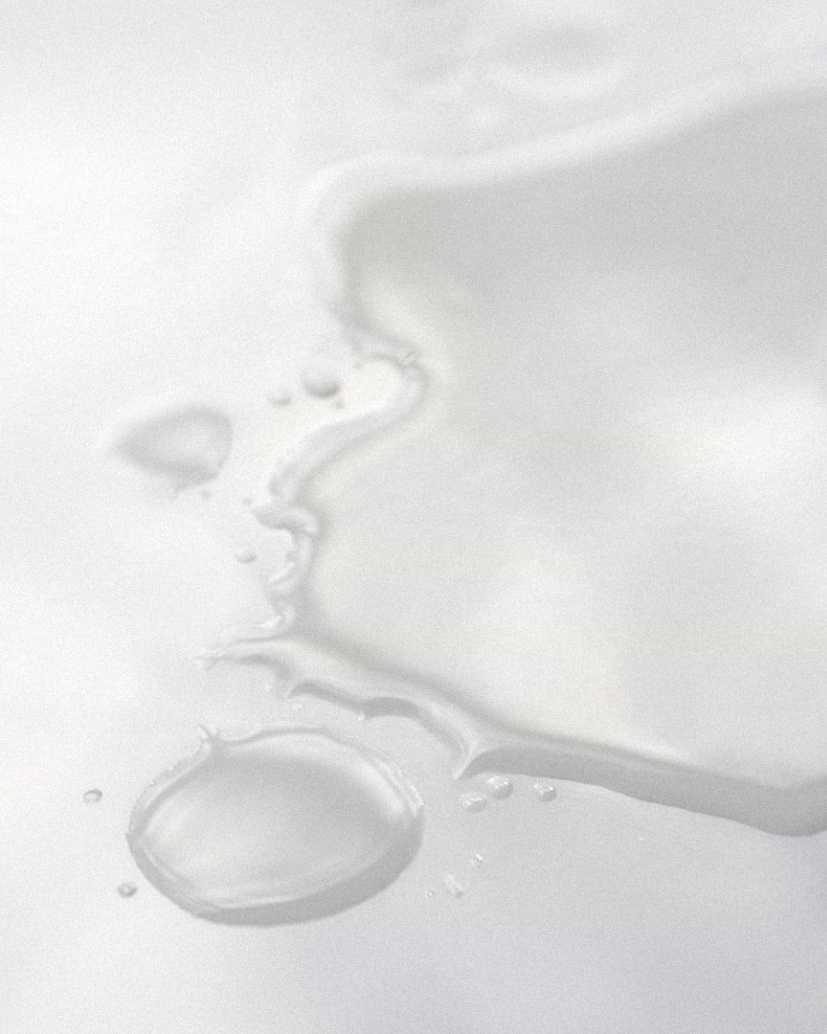 Texture close-up of MÁDARA Organic Skincare clarifying skin toner A2051 toner �swatch demonstrates consistency and finish.