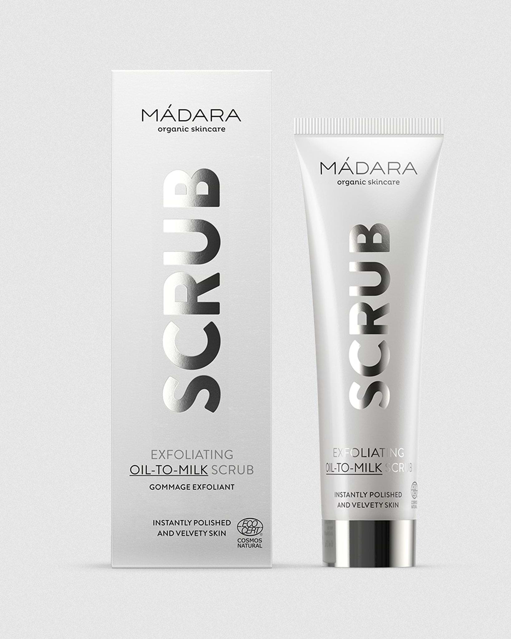 Model wearing MÁDARA Organic Skincare face scrub madara A2151 on skin; close-up portrait shows natural application results.