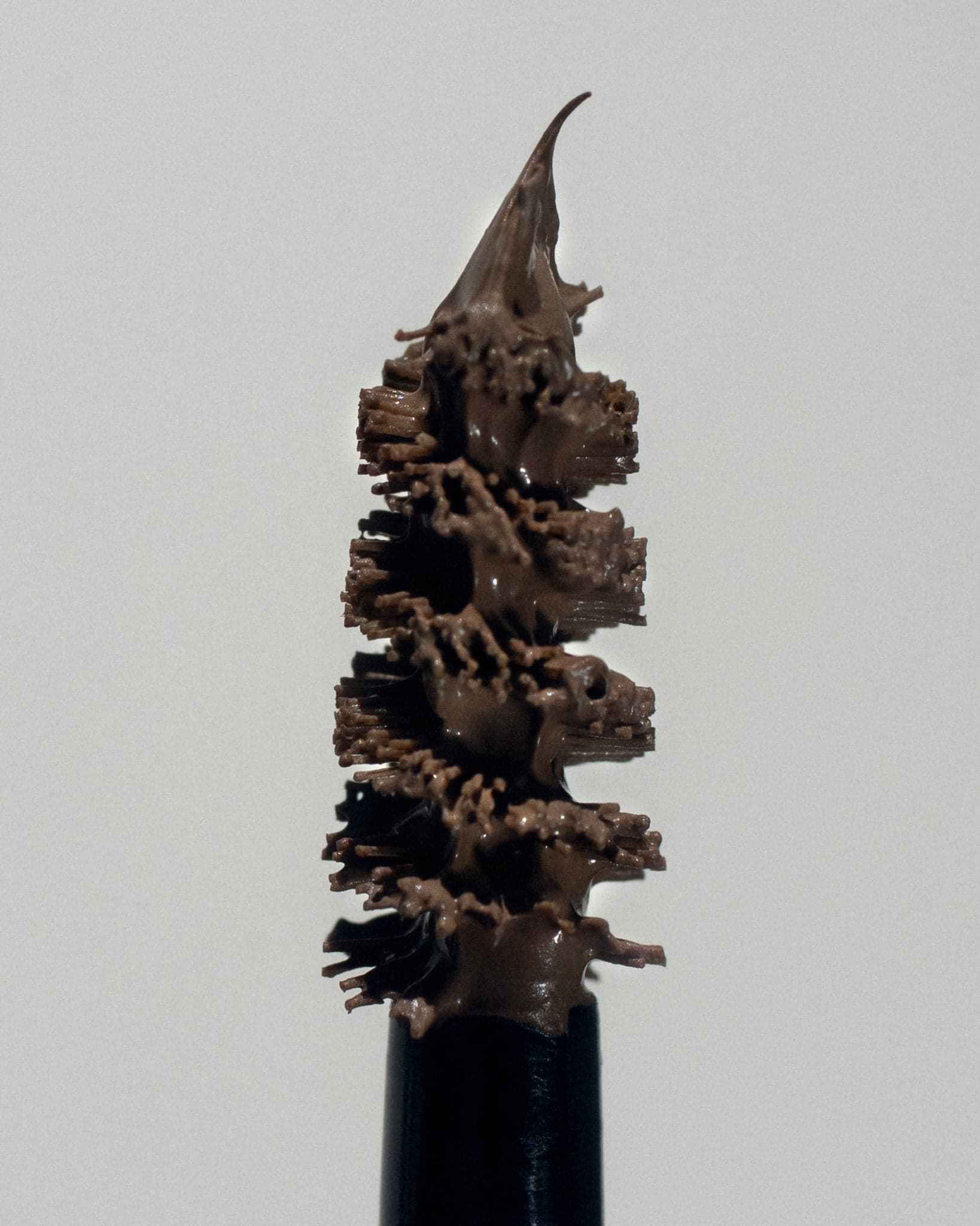 Texture close-up of MÁDARA Organic Skincare grow and fix ash brown A6704 �swatch demonstrates consistency and finish.