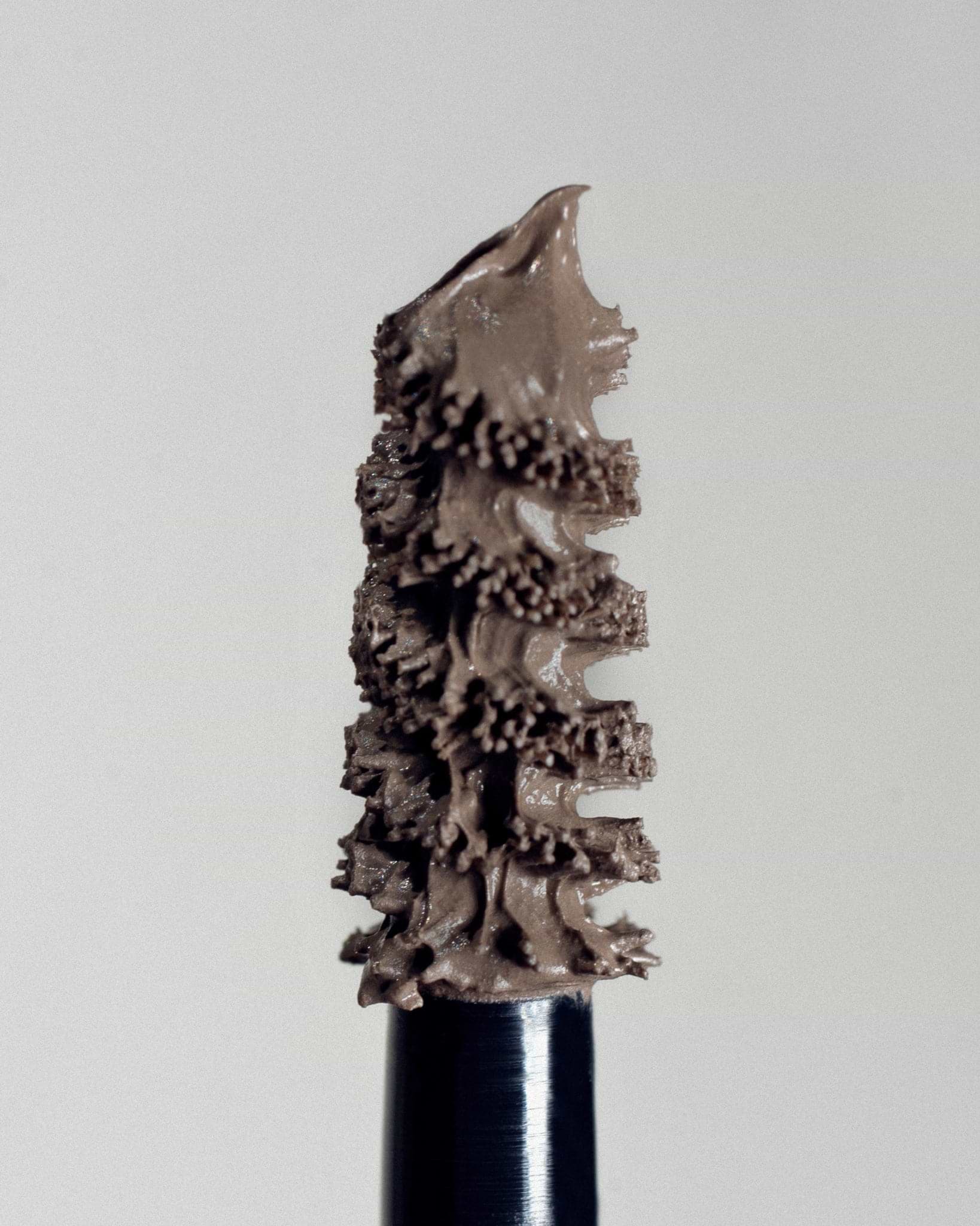 Texture close-up of MÁDARA Organic Skincare grow and fix frosty taupe A6703 �swatch demonstrates consistency and finish.