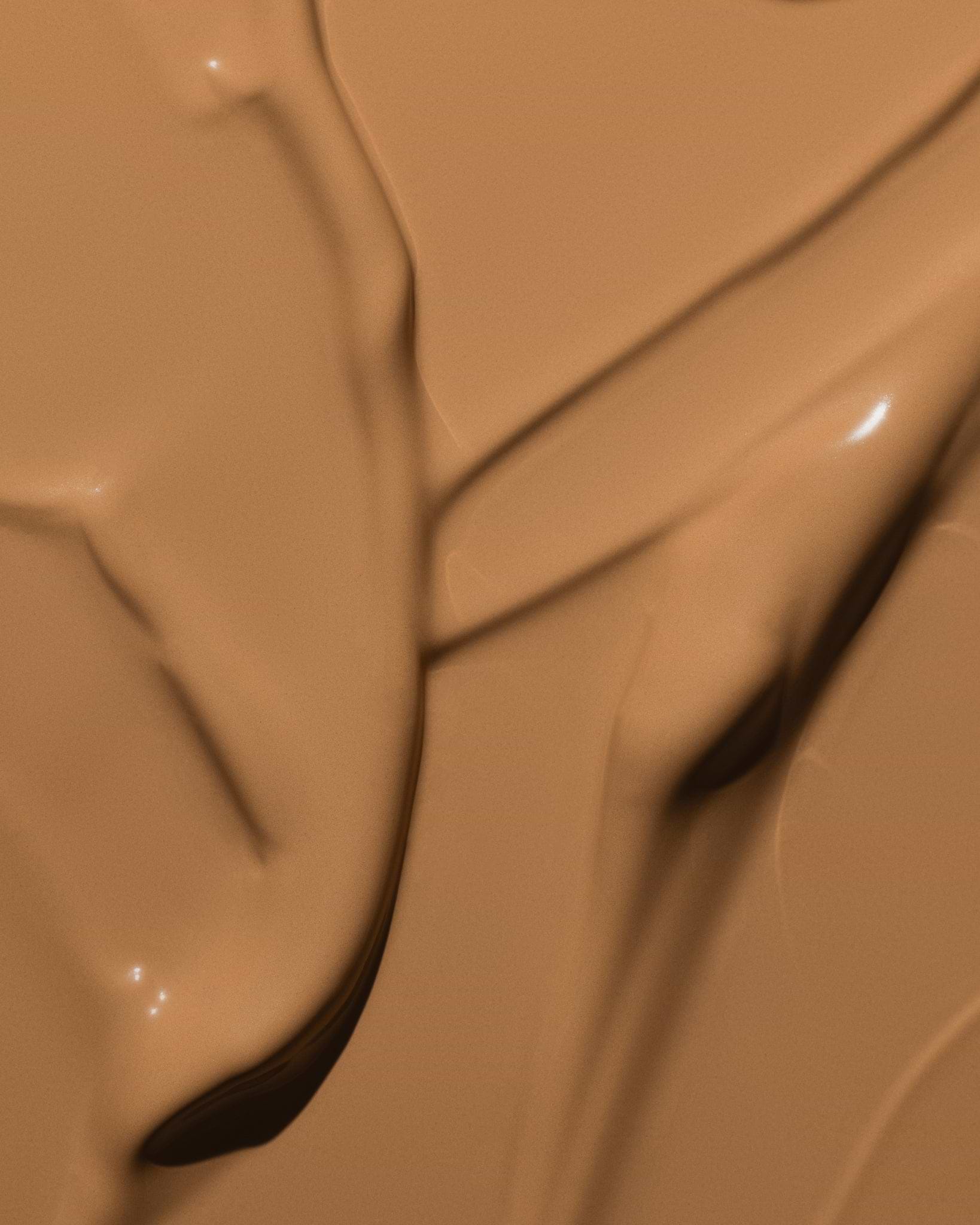 Texture close-up of MÁDARA Organic Skincare skinonym olive A6091 �swatch demonstrates consistency and finish.