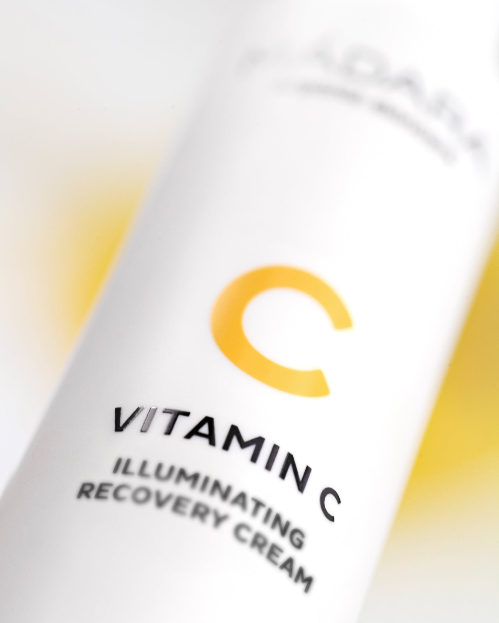 Vitamin C illuminating recovery cream packaging with a yellow 'C' logo on a white background.