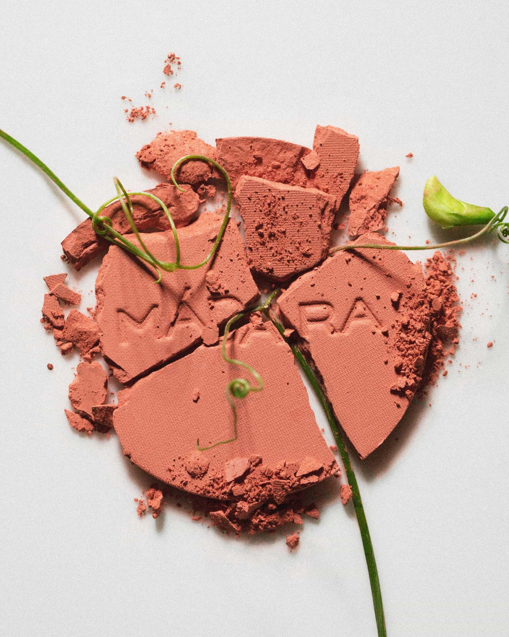 Texture close-up of MÁDARA Organic Skincare fierce flame blush A6821 �swatch demonstrates consistency and finish.