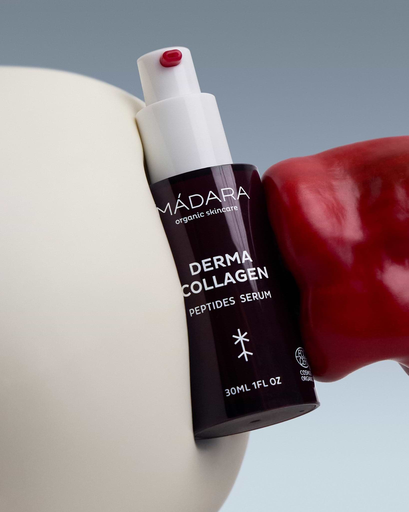 MÁDARA Organic Skincare skin firming serum A3061 serum product photo on plain background.