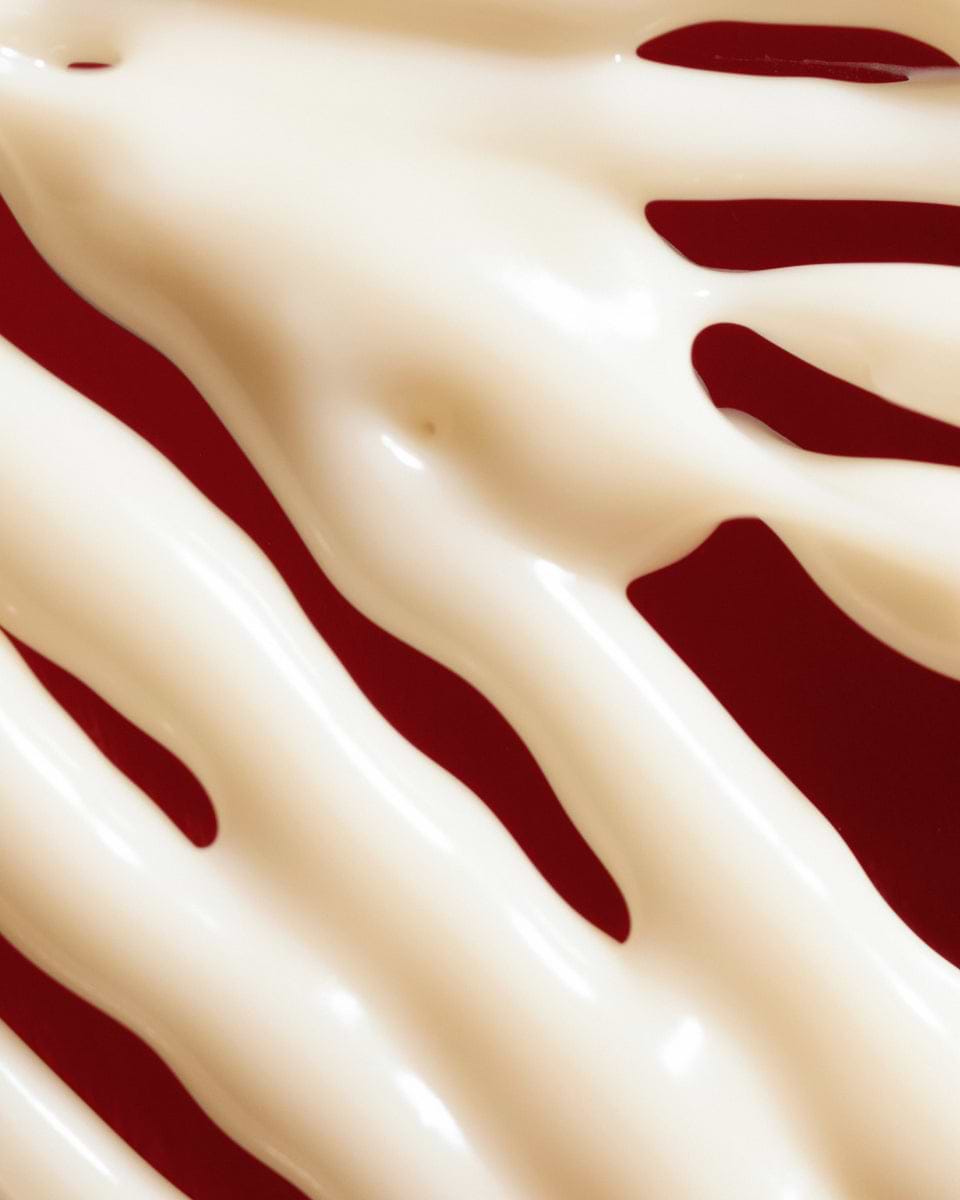 Texture close-up of MÁDARA Organic Skincare hydra silk firming cream A3051 face cream �swatch demonstrates consistency and finish
