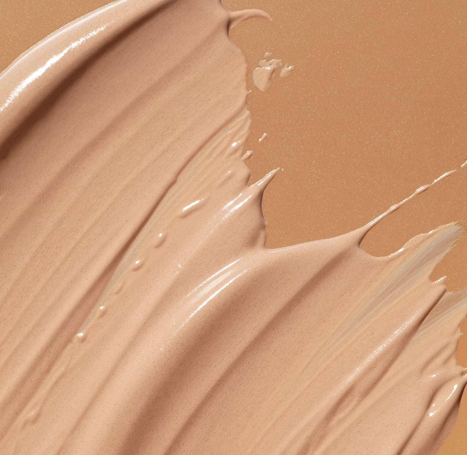 Close-up texture of mineral tinted sunscreen with a smooth, luminous finish 