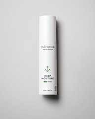 Mádara Deep Moisture cream tube on a gray background