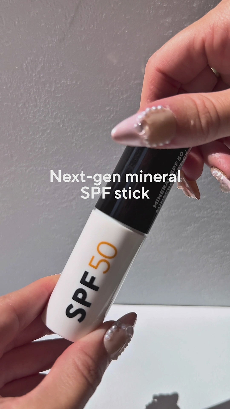 Woman applying SPF50 stick emphasizing the benefits of Instant protection and mess-free application and