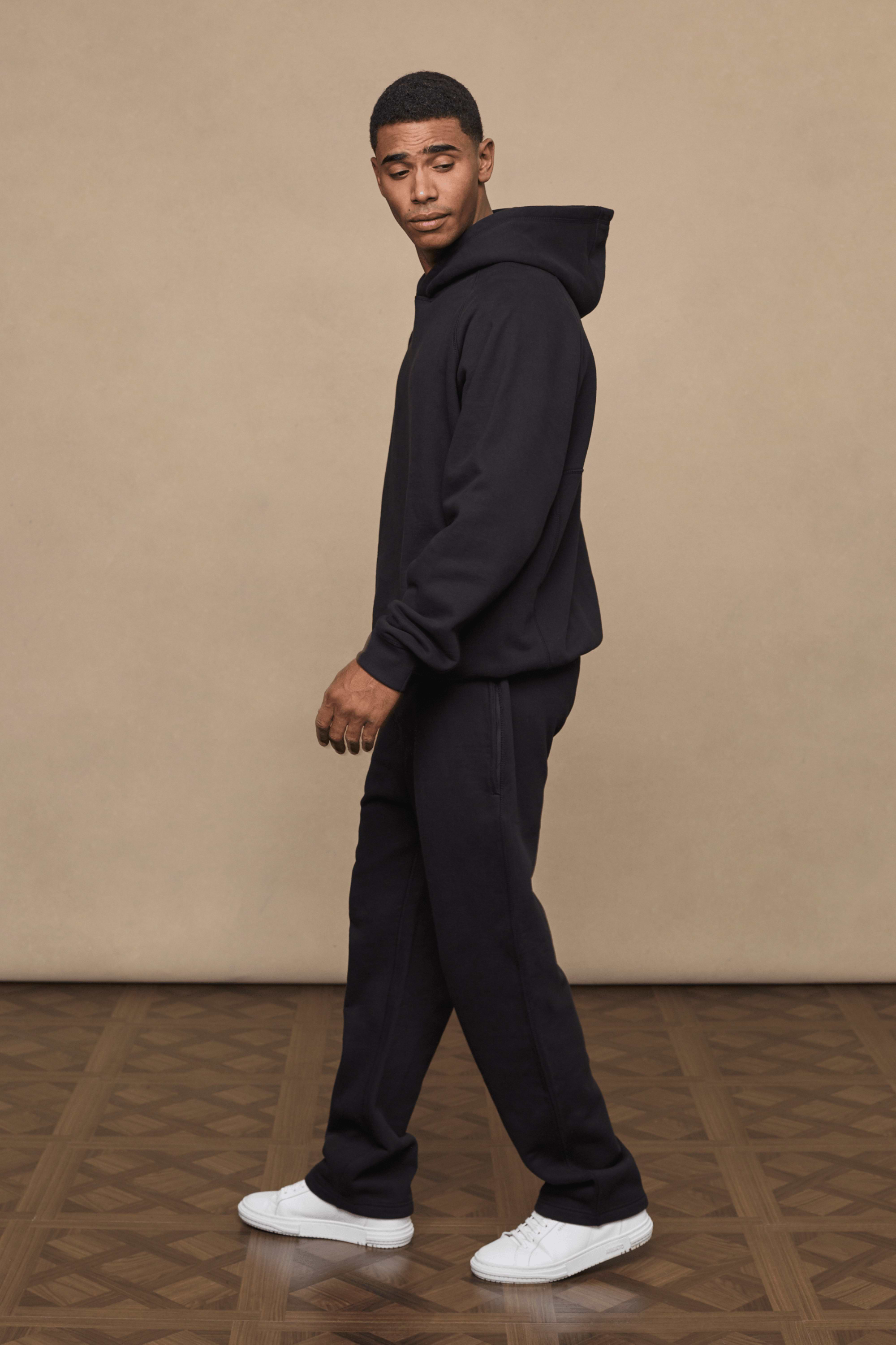 Men’s heavyweight cotton blend hoodie in Black with raglan sleeves by Raith