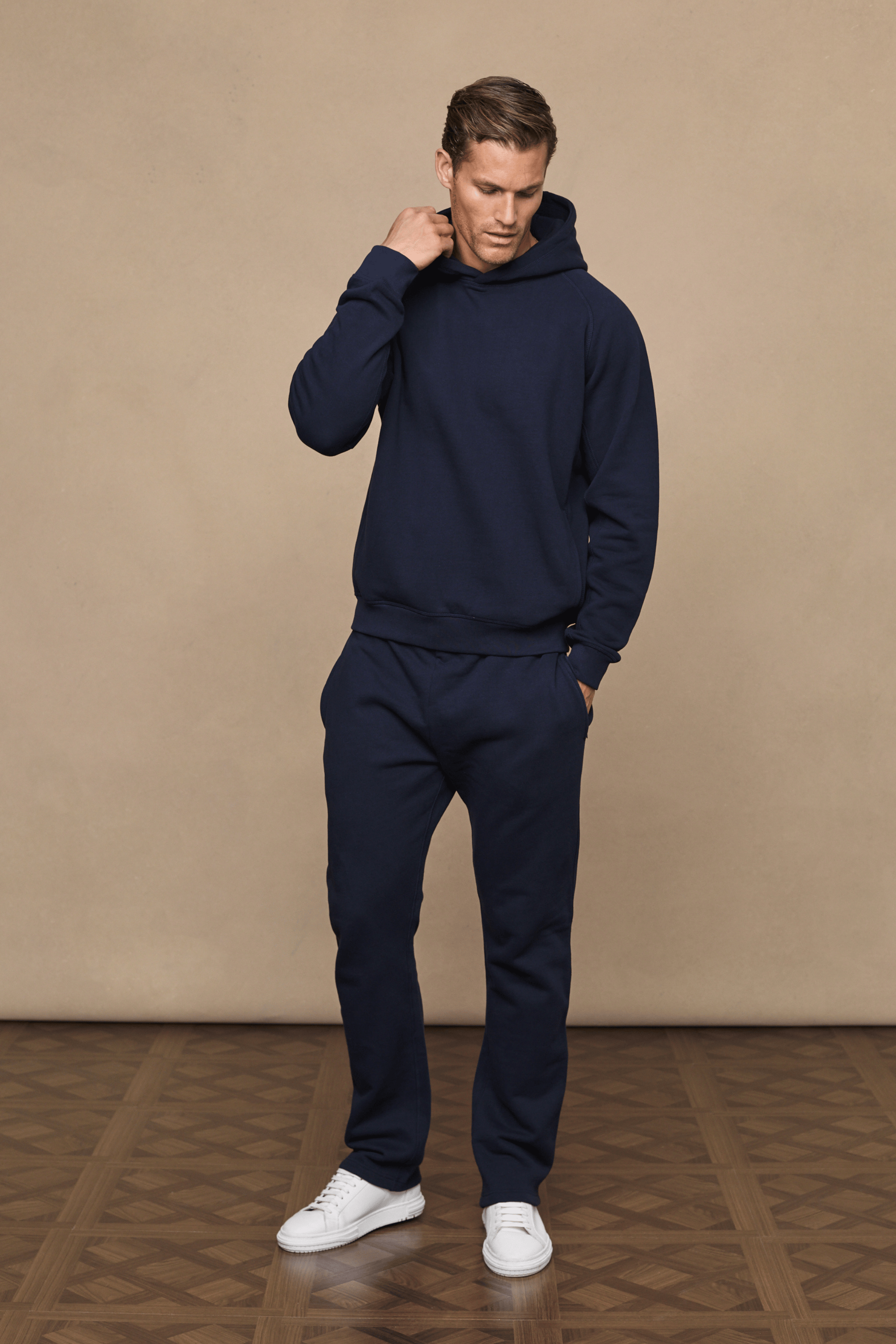 Men’s heavyweight cotton blend hoodie in navy with raglan sleeves by Raith