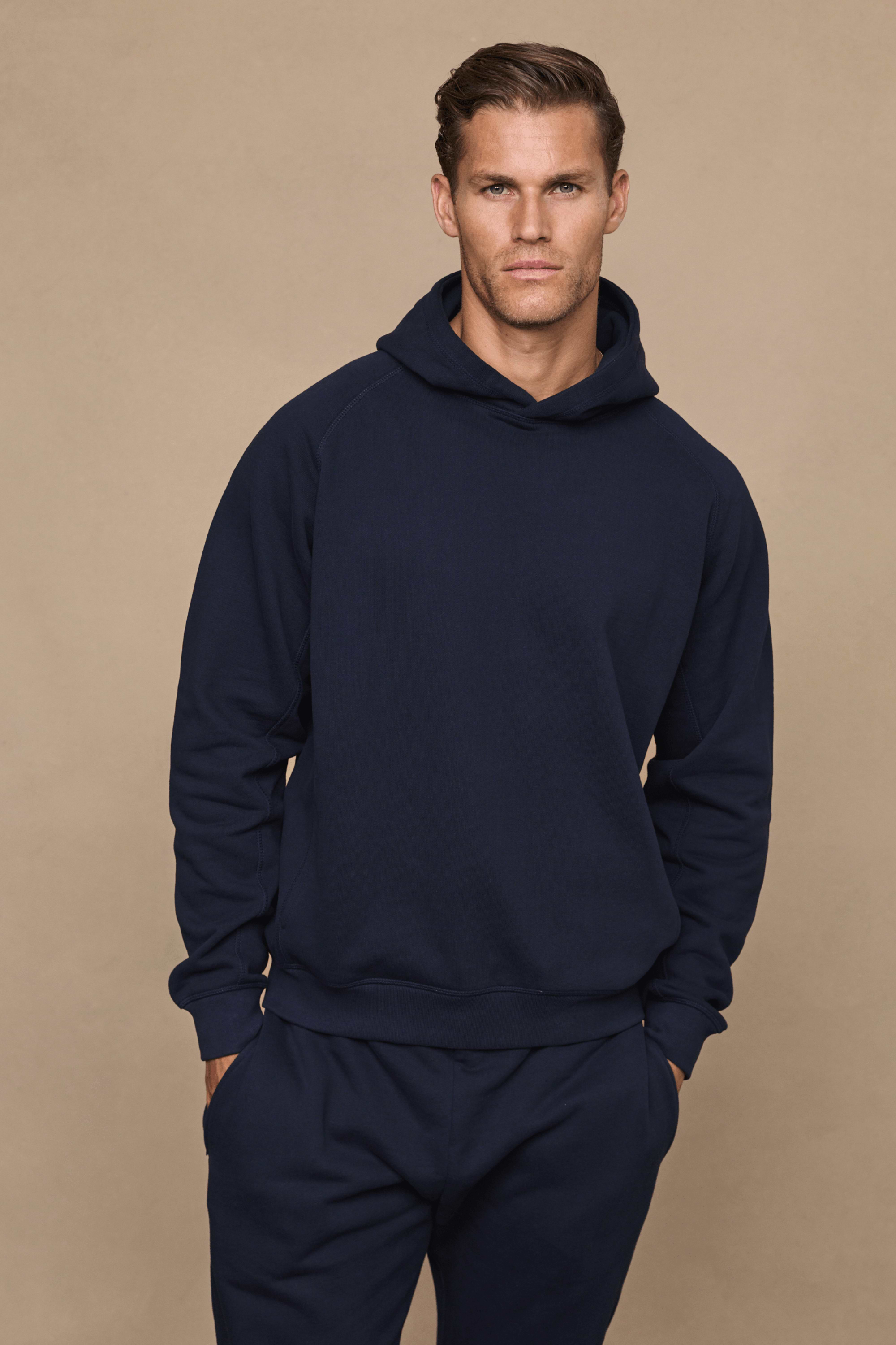 Men’s heavyweight cotton blend hoodie in navy with raglan sleeves by Raith