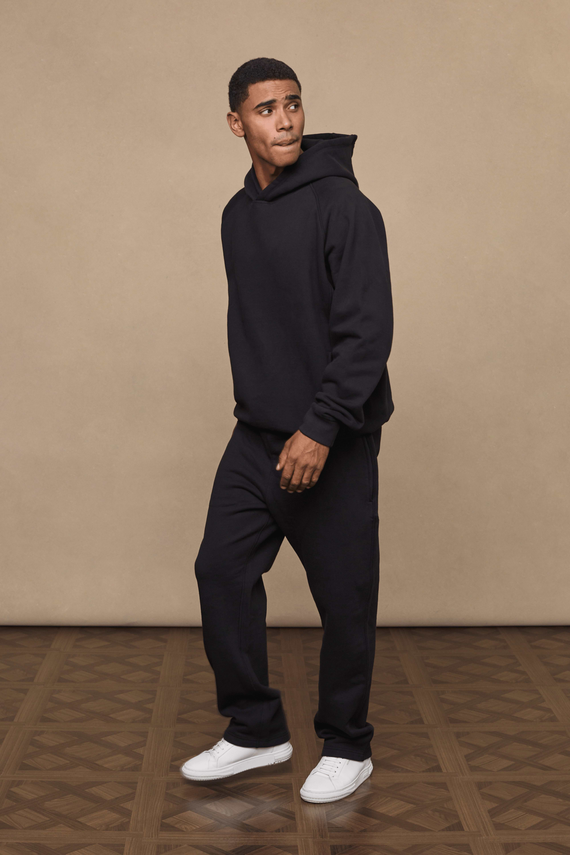 Men’s heavyweight cotton blend hoodie in Black with raglan sleeves by Raith