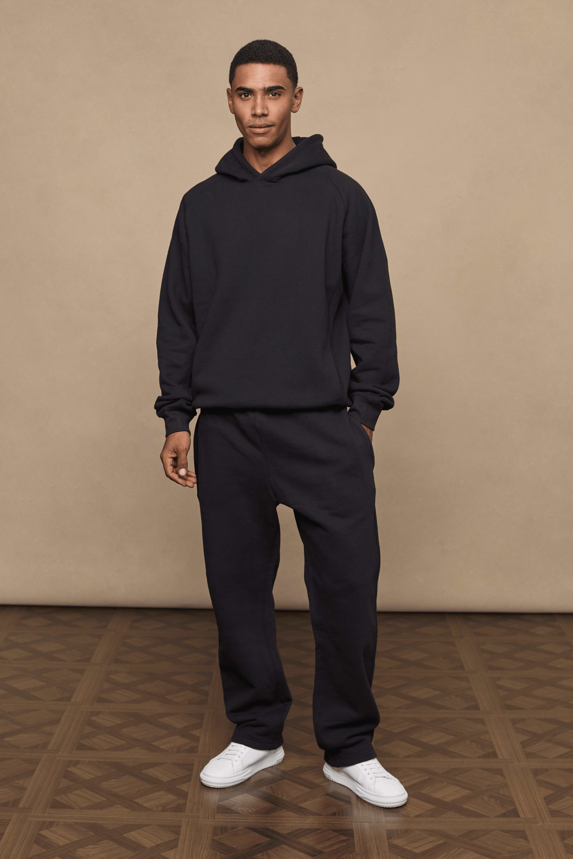 Men’s heavyweight cotton blend hoodie in Black with raglan sleeves by Raith