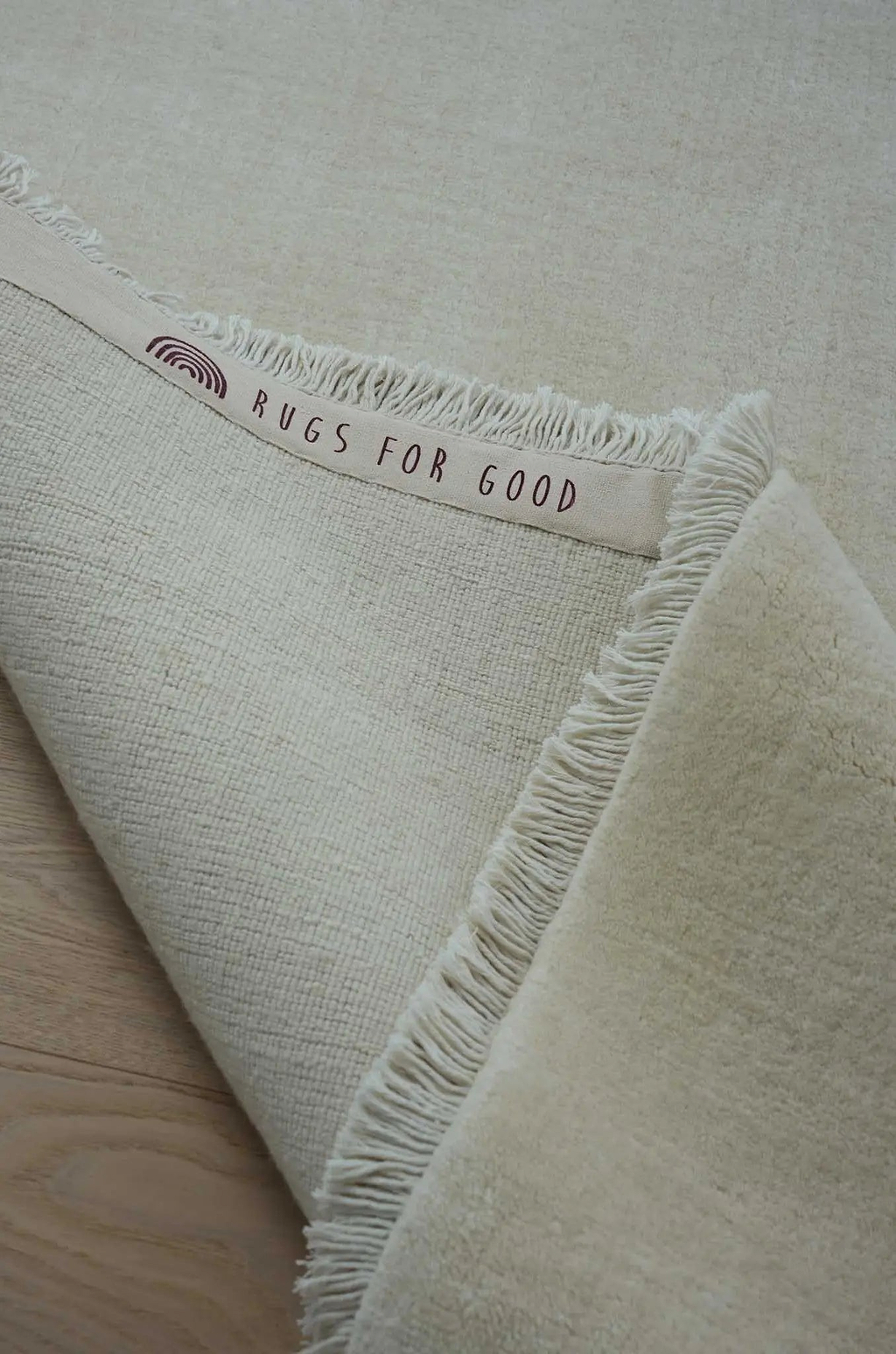 Sample of Bhakti Abrash Wool Blend Rug in Ivory