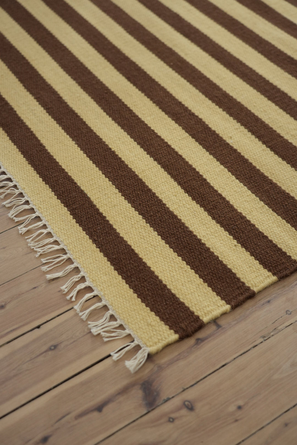 Solstice Striped Reversible Wool Rug in Choc Banana