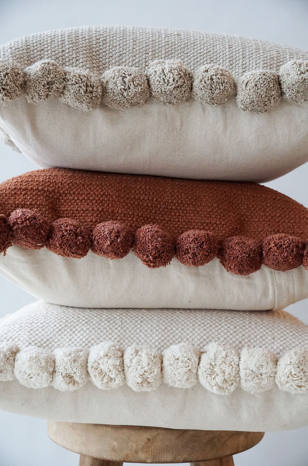 Luma Pom Pom Cushion in Clay