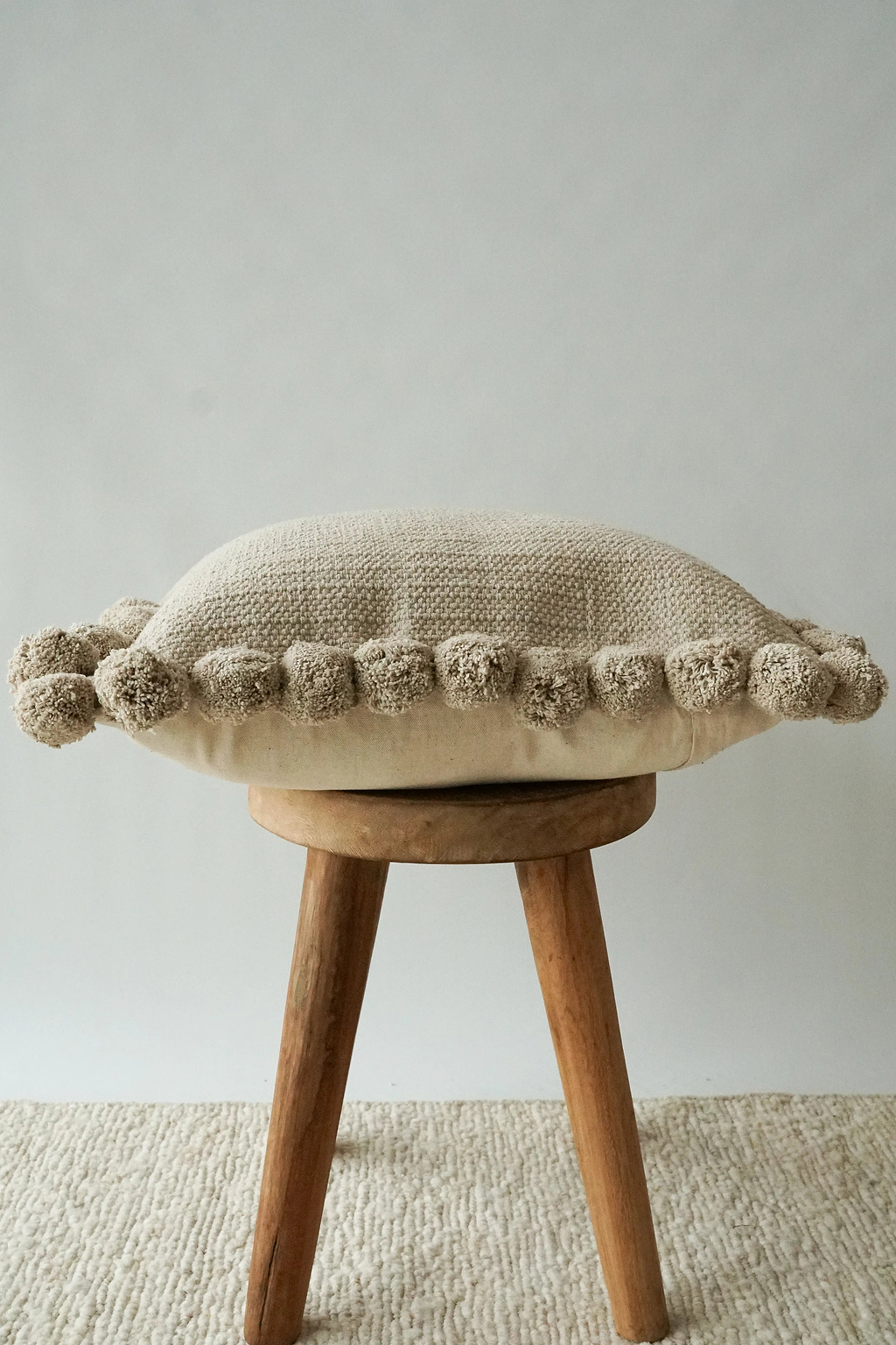 Luma Pom Pom Cushion in Grey