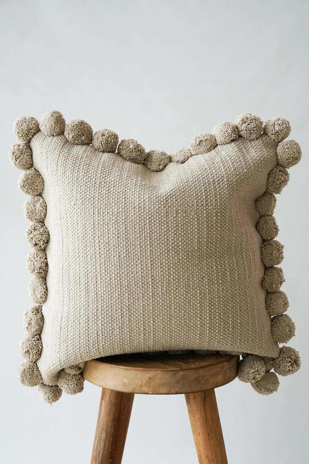 Luma Pom Pom Cushion in Grey