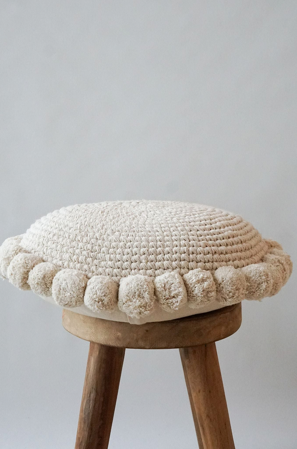 Luma Round Pom Pom Cushion in Natural