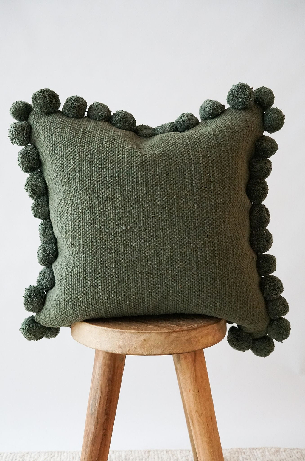Luma Pom Pom Cushion in Olive