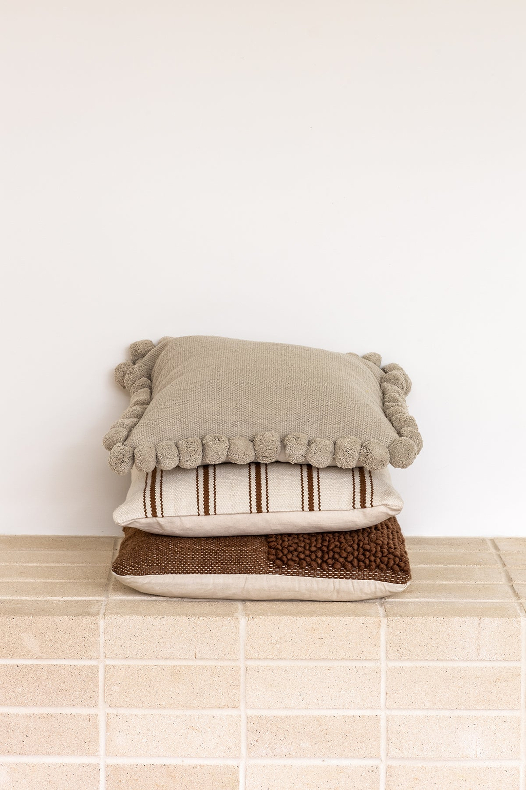 Luma Pom Pom Cushion in Grey