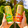 Two hands holding Au Vodka Tango Apple and Orange cans against a blurred green background