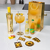 Au Vodka Pineapple Crush bottle with cocktail glass mixers and branded stickers on a kitchen counter