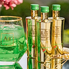 Au Vodka Green Watermelon bottles and a glass of green drink with ice