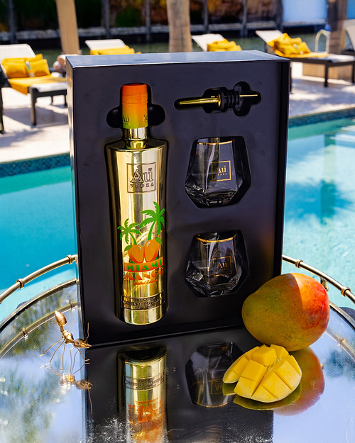 Au Vodka Miami Mango Limited Edition gift set with two glasses, a pourer, and mangoes