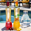 Au Vodka Red Cherry and Miami bottles, with two glasses of cocktails and a decanter of water