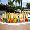Au Vodka bottles and cocktails by a pool
