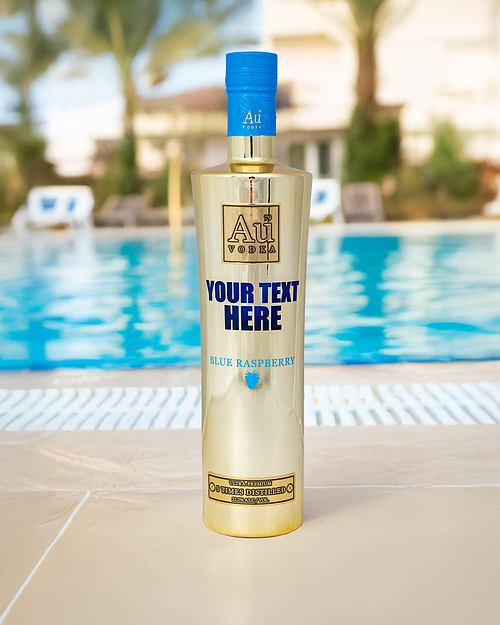 Au Vodka Blue Raspberry bottle with custom text by a swimming pool