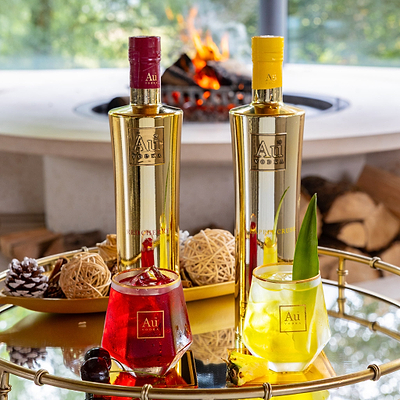 Au Vodka Red Cherry and Apple Crush bottle bundle with cocktails on a tray