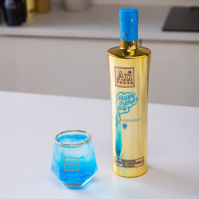 Au Vodka USA 750ml Blue Raspberry bottle with Happy Fathers Day label next to a glass of blue liquid