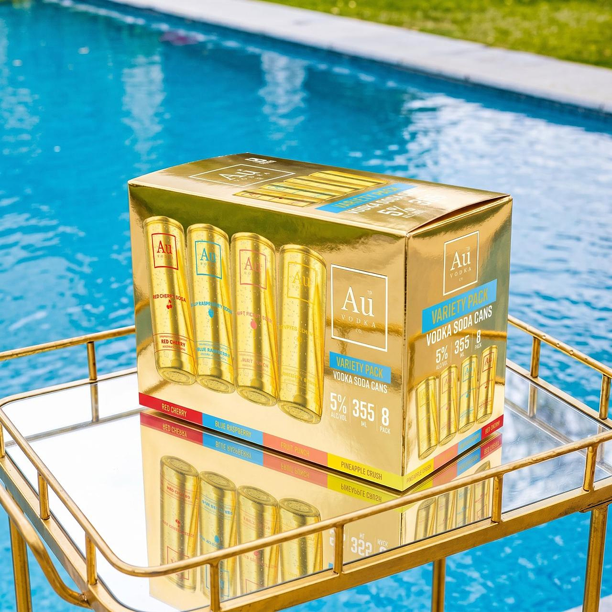 Au Vodka USA Variety Pack Vodka Soda Cans on a mirrored tray by a pool