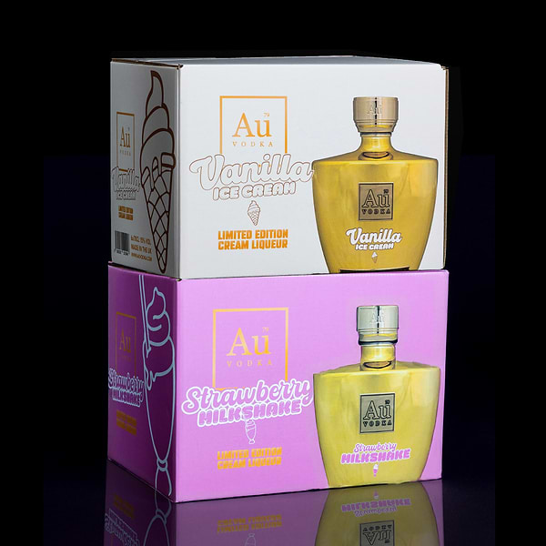 Au Vodka Vanilla Ice Cream and Strawberry Milkshake cream liqueur boxes stacked on a black background