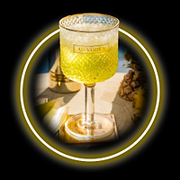 Au Vodka cocktail in a patterned glass with ice and pineapple garnish