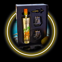 Gold bottle of vodka with palm trees and mangoes, two glasses, and a bottle stopper in a gift box