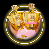 Two gold Au Vodka bottles in Vanilla Ice Cream and Strawberry Milkshake flavors held by hands