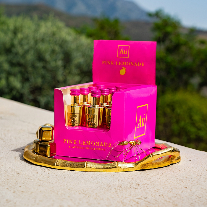 Au Vodka USA Pink Lemonade mini bottles in a pink box on a gold tray