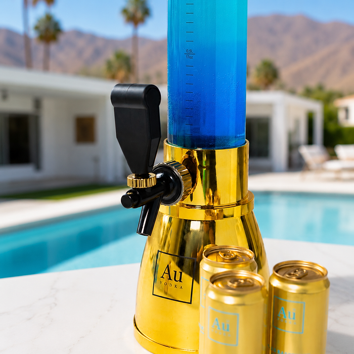 Au Vodka USA merchandise, a gold drink dispenser with blue liquid and three gold cans by a pool