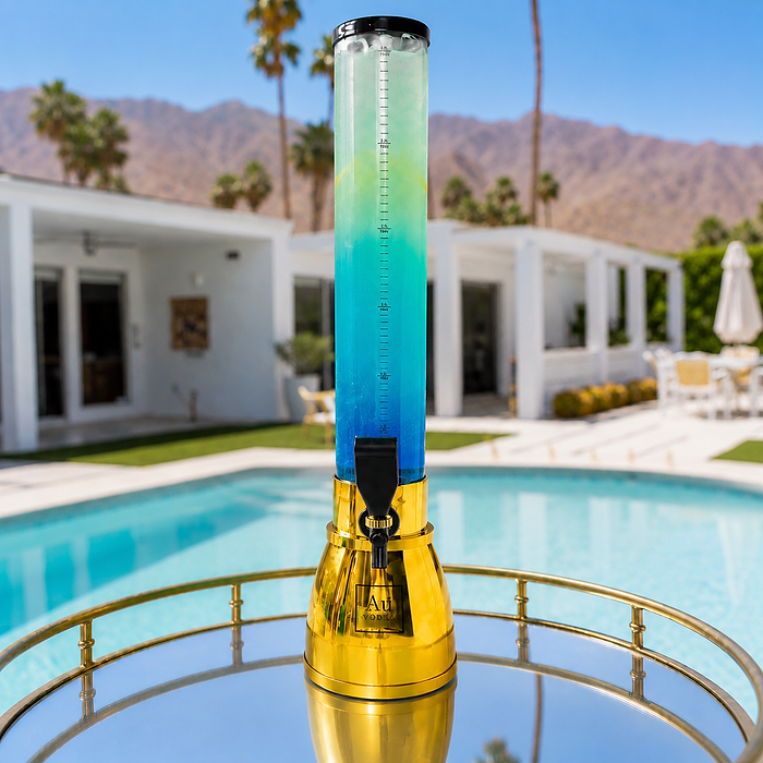 Au Vodka USA drink dispenser with blue and green liquid on a gold base