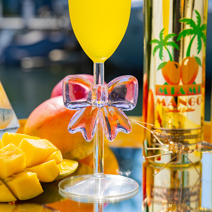 Au Vodka Miami Mango Bottle & Glassware Bundle with mango slices