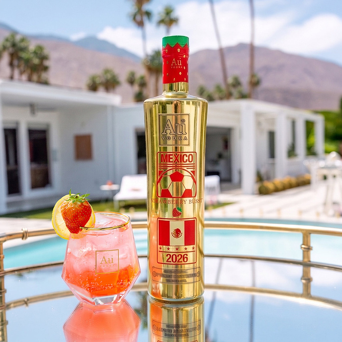 Au Vodka USA Strawberry Burst 750ml bottle with a cocktail on a mirrored tray